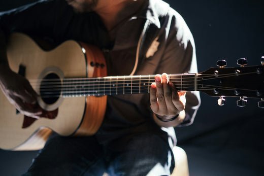 Man playing music on guitar 